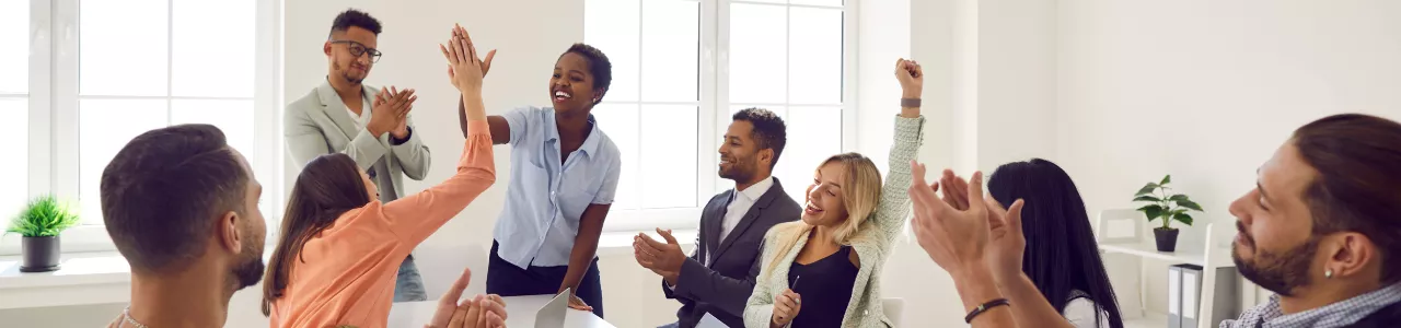 Team members receiving recognition and monetary rewards as part of an employee incentive program 