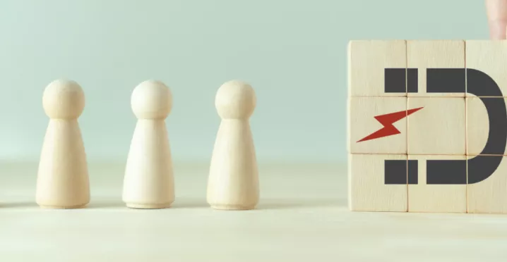 A photo that shows a magnet drawing in figures of people