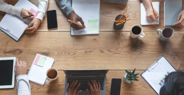 Employees working at a table