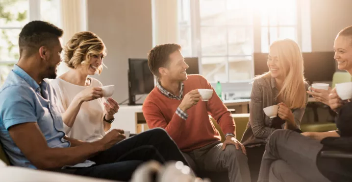 Six colleagues discussing in a conference room