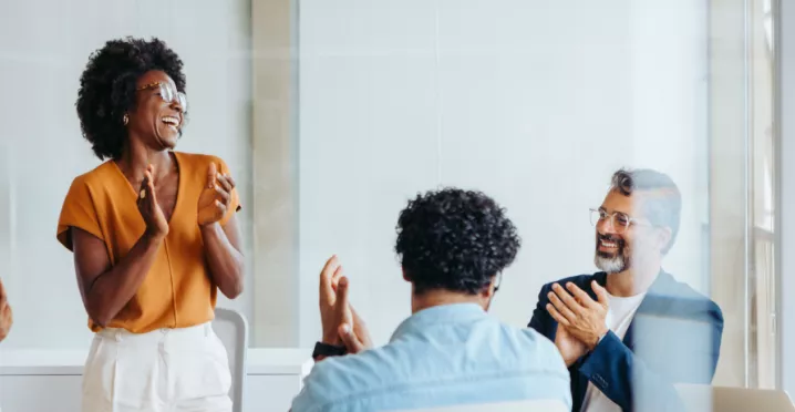 Team celebrating around a table