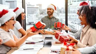 Employees opening their holiday gifts of appreciation