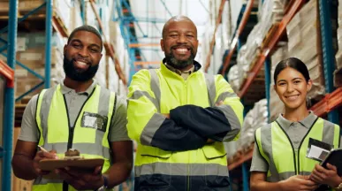 Three offline employees smiling