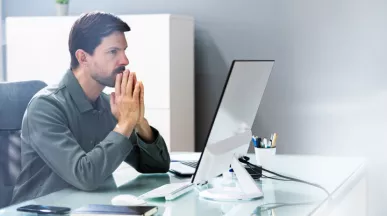 An upset employee sitting at their desk